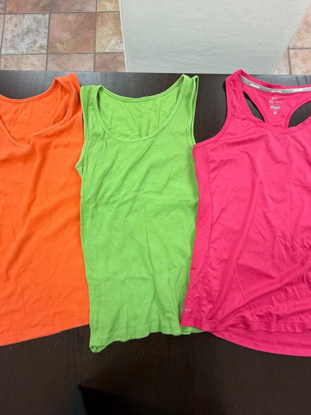 Three size medium tank tops

One does not show the tag because the tag has faded